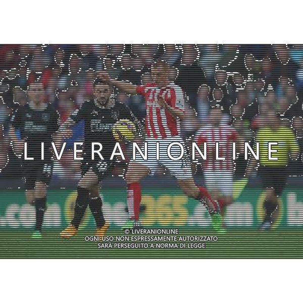 Burnley\'s Danny Ings (L) and Stoke City\'s Steve Sidwell in action during todays match Photographer Jack Phillips/CameraSport Football - Barclays Premiership - Stoke City v Burnley - Saturday 22nd November 2014 - Britannia Stadium - Stoke © CameraSport - 43 Linden Ave. Countesthorpe. Leicester. England. LE8 5PG - Tel: +44 (0) 116 277 4147 - admin@camerasport.com - www.camerasport.com ag aldo liverani sas only italy