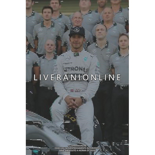 Lewis Hamilton (GBR) Mercedes AMG F1 at a team photograph. 23.11.2014. Formula 1 World Championship, Rd 19, Abu Dhabi Grand Prix, Yas Marina Circuit, Abu Dhabi, Race Day. AG ALDO LIVERANI SAS ONLY ITALY