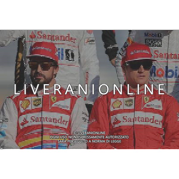 Fernando Alonso (ESP), Scuderia Ferrari and Kimi Raikkonen (FIN), Scuderia Ferrari 23.11.2014. Formula 1 World Championship, Rd 19, Abu Dhabi Grand Prix, Yas Marina Circuit, Abu Dhabi, Race Day. AG ALDO LIVERANI SAS ONLY ITALY