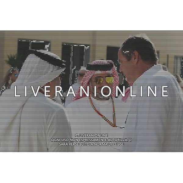 HRH Prince Salman bin Hamad Al Khalifa, Crown Prince of Bahrain (Left) with Gerhard Berger (AUT) (Right). 23.11.2014. Formula 1 World Championship, Rd 19, Abu Dhabi Grand Prix, Yas Marina Circuit, Abu Dhabi, Race Day. AG ALDO LIVERANI SAS ONLY ITALY