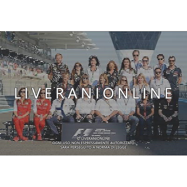 The Press Officers\' Group Photograph. 23.11.2014. Formula 1 World Championship, Rd 19, Abu Dhabi Grand Prix, Yas Marina Circuit, Abu Dhabi, Race Day. AG ALDO LIVERANI SAS ONLY ITALY