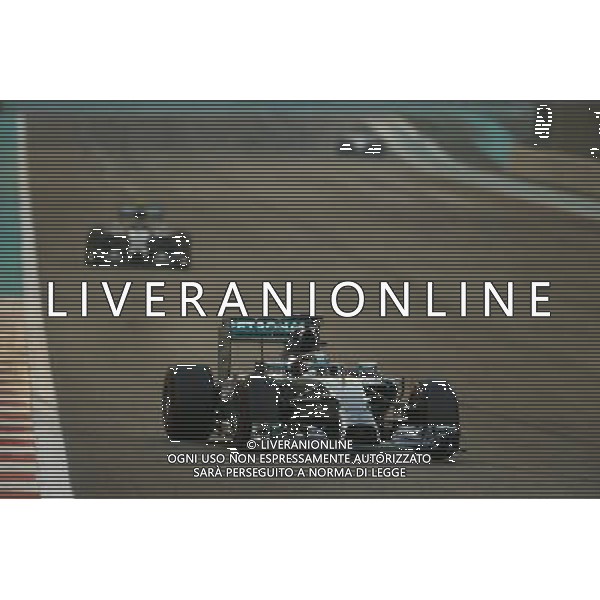 Lewis Hamilton (GBR) Mercedes AMG F1 W05 leads the race from team mate Nico Rosberg (GER) Mercedes AMG F1 W05. 23.11.2014. Formula 1 World Championship, Rd 19, Abu Dhabi Grand Prix, Yas Marina Circuit, Abu Dhabi, Race Day. AG ALDO LIVERANI SAS ONLY ITALY