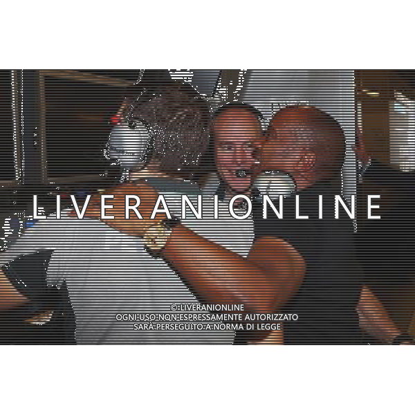 Anthony Hamilton (GBR) celebrates victory and World Championship for son Lewis Hamilton (GBR) Mercedes AMG F1 with Jock Clear (GBR) Mercedes AMG F1. 23.11.2014. Formula 1 World Championship, Rd 19, Abu Dhabi Grand Prix, Yas Marina Circuit, Abu Dhabi, Race Day. AG ALDO LIVERANI SAS ONLY ITALY