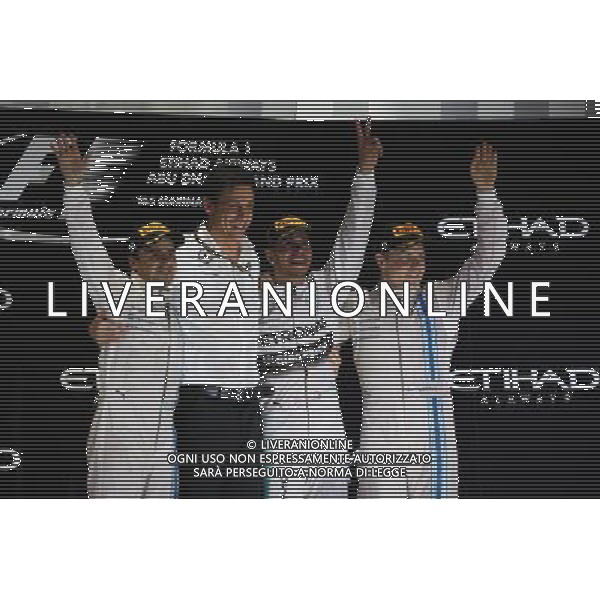 The podium (L to R): Felipe Massa (BRA) Williams, second; Toto Wolff (GER) Mercedes AMG F1 Shareholder and Executive Director; Lewis Hamilton (GBR) Mercedes AMG F1, race winner and World Champion; Valtteri Bottas (FIN) Williams, third. 23.11.2014. Formula 1 World Championship, Rd 19, Abu Dhabi Grand Prix, Yas Marina Circuit, Abu Dhabi, Race Day. AG ALDO LIVERANI SAS ONLY ITALY