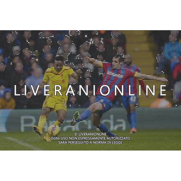 Liverpool\'s Raheem Sterling gets a shot in despite the attentions of Crystal Palace\'s Scott Dann Photographer Craig Mercer/CameraSport Football - Barclays Premiership - Crystal Palace v Liverpool - Sunday 23rd November 2014 - Selhurst Park - London å© CameraSport - 43 Linden Ave. Countesthorpe. Leicester. England. LE8 5PG - Tel: +44 (0) 116 277 4147 - admin@camerasport.com - www.camerasport.com /AGENZIA ALDO LIVERANI SAS - ITALY ONLY - EDITORIAL USE ONLY