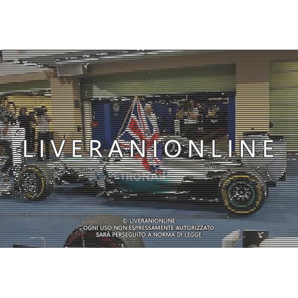 Race winner and World Champion Lewis Hamilton (GBR) Mercedes AMG F1 W05 celebrates in parc ferme. 23.11.2014. Formula 1 World Championship, Rd 19, Abu Dhabi Grand Prix, Yas Marina Circuit, Abu Dhabi, Race Day. AG ALDO LIVERANI SAS ONLY ITALY