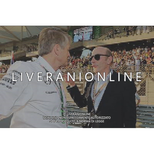 (L to R): Thomas Weber (GER) Member of the Board of Management of Daimler AG with Donald Mackenzie (GBR) CVC Capital Partners Managing Partner, Co Head of Global Investments on the grid. 23.11.2014. Formula 1 World Championship, Rd 19, Abu Dhabi Grand Prix, Yas Marina Circuit, Abu Dhabi, Race Day. AG ALDO LIVERANI SAS ONLY ITALY