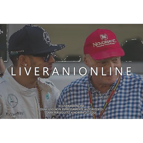 (L to R): Lewis Hamilton (GBR) Mercedes AMG F1 and Niki Lauda (AUT) Mercedes Non-Executive Chairman. 23.11.2014. Formula 1 World Championship, Rd 19, Abu Dhabi Grand Prix, Yas Marina Circuit, Abu Dhabi, Race Day. AG ALDO LIVERANI SAS ONLY ITALY