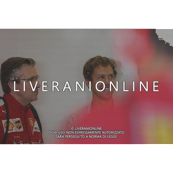 Pat Fry (GBR), Scuderia Ferrari, Technical Director and Sebastian Vettel (GER) 25.11.2014. Formula 1 Testing, Day One, Yas Marina Circuit, Abu Dhabi, Tuesday. AG ALDO LIVERANI SAS ONLY ITALY