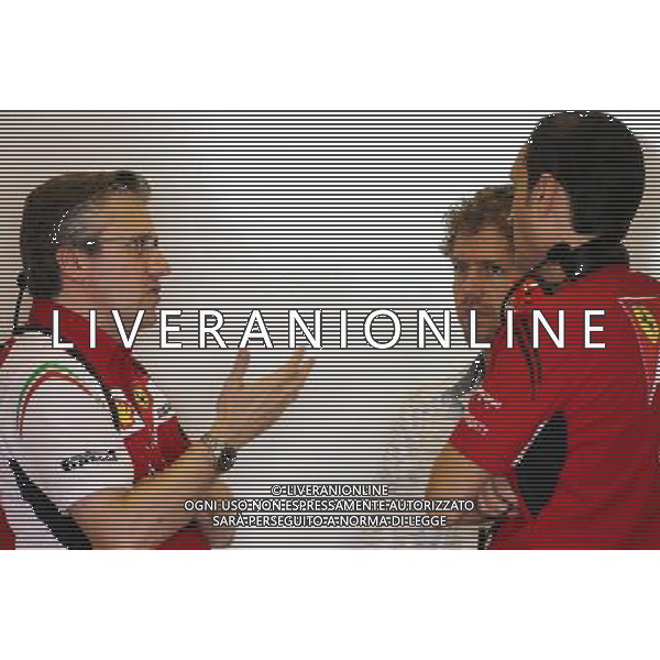 Pat Fry (GBR), Scuderia Ferrari, Technical Director and Sebastian Vettel (GER) 25.11.2014. Formula 1 Testing, Day One, Yas Marina Circuit, Abu Dhabi, Tuesday. AG ALDO LIVERANI SAS ONLY ITALY