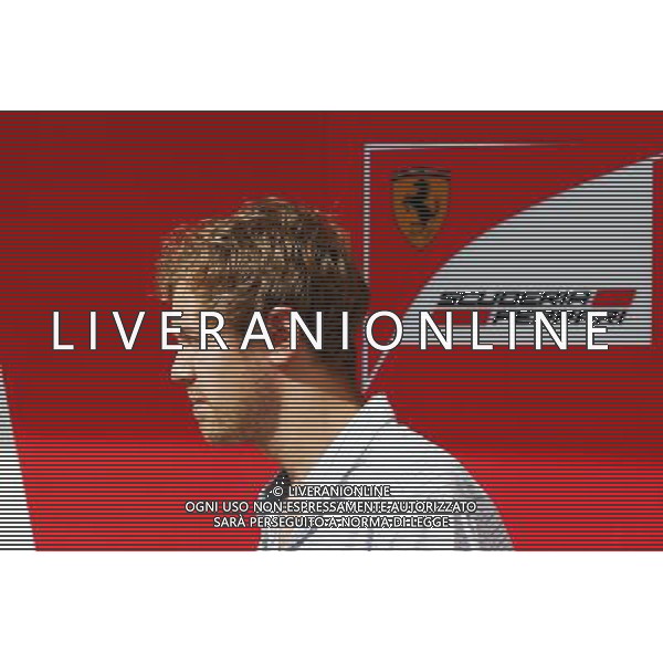 Sebastian Vettel (GER) leaves the Ferrari garage. 25.11.2014. Formula 1 Testing, Day One, Yas Marina Circuit, Abu Dhabi, Tuesday. AG ALDO LIVERANI SAS ONLY ITALY