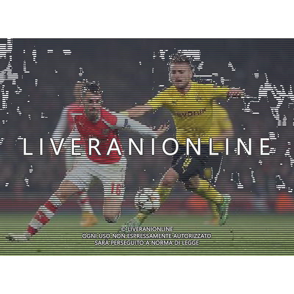 Arsenal\'s Aaron Ramsey under pressure from Borussia Dortmund\'s Ciro Immobile Photographer Kieran Galvin/CameraSport Football - UEFA Champions League First Round Group D - Arsenal v Borussia Dortmund - Wednesday 26th November 2014 - Emirates Stadium - London © CameraSport - 43 Linden Ave. Countesthorpe. Leicester. England. LE8 5PG - Tel: +44 (0) 116 277 4147 - admin@camerasport.com - www.camerasport.com AG ALDO LIVERANI SAS ONLY ITALY