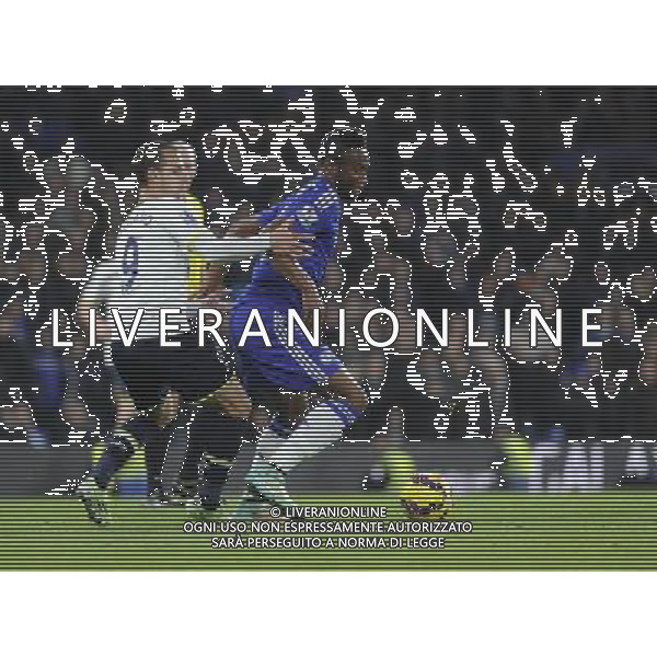 Chelsea\'s Mikel John Obi holds off the challenge from Tottenham Hotspur\'s Roberto Soldado Photographer Ashley Western/CameraSport Football - Barclays Premiership - Chelsea v Tottenham Hotspur - Wednesday 3rd December 2014 - Stamford Bridge - London © CameraSport - 43 Linden Ave. Countesthorpe. Leicester. England. LE8 5PG - Tel: +44 (0) 116 277 4147 - admin@camerasport.com - www.camerasport.com AG ALDO LIVERANI SAS ONLY ITALY