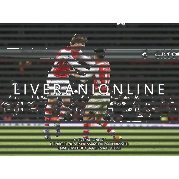 Arsenal\'s Alexis Sanchez celebrates the winning goal with Arsenal\'s Nacho Monreal Photographer Kieran Galvin/CameraSport Football - Barclays Premiership - Arsenal v Southampton - Wednesday 3rd December 2014 - The Emirates Stadium - London © CameraSport - 43 Linden Ave. Countesthorpe. Leicester. England. LE8 5PG - Tel: +44 (0) 116 277 4147 - admin@camerasport.com - www.camerasport.com AG ALDO LIVERANI SAS ONLY ITALY