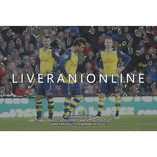 Arsenal\'s players look disconsolate as the game ends Photographer Mick Walker/CameraSport Football - Barclays Premiership - Stoke City v Arsenal - Saturday 6th December 2014 - Britannia stadium - Stoke © CameraSport - 43 Linden Ave. Countesthorpe. Leicester. England. LE8 5PG - Tel: +44 (0) 116 277 4147 - admin@camerasport.com - www.camerasport.com AG ALDO LIVERANI SAS ONLY ITALY