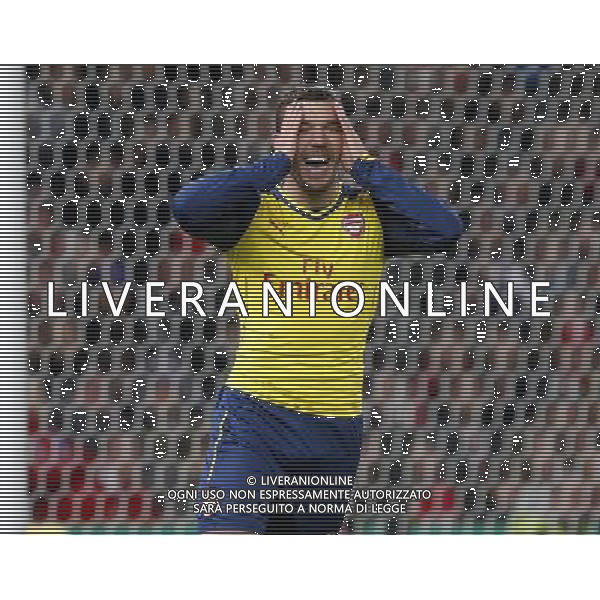 Arsenal\'s Lukas Podolski reacts to a missed chance Photographer Mick Walker/CameraSport Football - Barclays Premiership - Stoke City v Arsenal - Saturday 6th December 2014 - Britannia stadium - Stoke © CameraSport - 43 Linden Ave. Countesthorpe. Leicester. England. LE8 5PG - Tel: +44 (0) 116 277 4147 - admin@camerasport.com - www.camerasport.com AG ALDO LIVERANI SAS ONLY ITALY