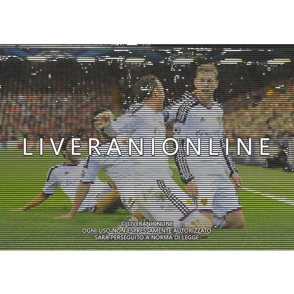 FC Basel\'s Fabian Frei is mobbed by team mates after scoring the opening goal Photographer Dave Howarth/CameraSport Football - UEFA Champions League Group B - Liverpool v Basel - Tuesday 9th December 2014 - Anfield - Liverpool © CameraSport - 43 Linden Ave. Countesthorpe. Leicester. England. LE8 5PG - Tel: +44 (0) 116 277 4147 - admin@camerasport.com - www.camerasport.com AG ALDO LIVERANI SAS ONLY ITALY