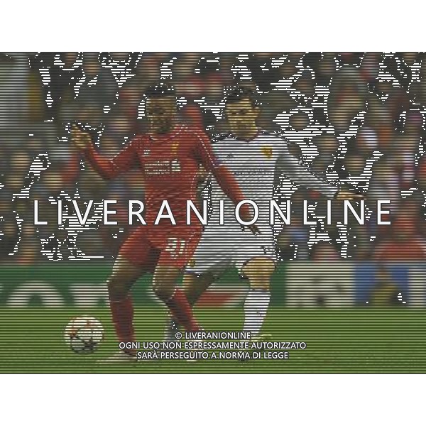Liverpool\'s Raheem Sterling (left) battles with FC Basel\'s Behrang Safari Photographer Dave Howarth/CameraSport Football - UEFA Champions League Group B - Liverpool v Basel - Tuesday 9th December 2014 - Anfield - Liverpool © CameraSport - 43 Linden Ave. Countesthorpe. Leicester. England. LE8 5PG - Tel: +44 (0) 116 277 4147 - admin@camerasport.com - www.camerasport.com AG ALDO LIVERANI SAS ONLY ITALY