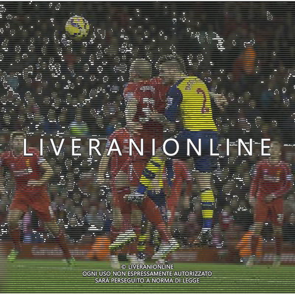 Arsenal\'s Mathieu Debuchy out jumps Liverpool\'s Martin Skrtel and scores his sides equalising goal to make the score 1-1 Photographer Stephen White/CameraSport Football - Barclays Premiership - Liverpool v Arsenal - Sunday 21st December 2014 - Anfield - Liverpool © CameraSport - 43 Linden Ave. Countesthorpe. Leicester. England. LE8 5PG - Tel: +44 (0) 116 277 4147 - admin@camerasport.com - www.camerasport.com /Agenzia Aldo Liverani Sas - ITALY ONLY - EDITORIAL USE ONLY