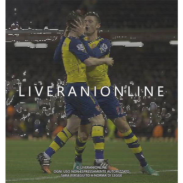 Arsenal\'s Mathieu Debuchy celebrates scoring his sides equalising goal to make the score 1-1 with team-mate Olivier Giroud Photographer Stephen White/CameraSport Football - Barclays Premiership - Liverpool v Arsenal - Sunday 21st December 2014 - Anfield - Liverpool © CameraSport - 43 Linden Ave. Countesthorpe. Leicester. England. LE8 5PG - Tel: +44 (0) 116 277 4147 - admin@camerasport.com - www.camerasport.com /Agenzia Aldo Liverani Sas - ITALY ONLY - EDITORIAL USE ONLY