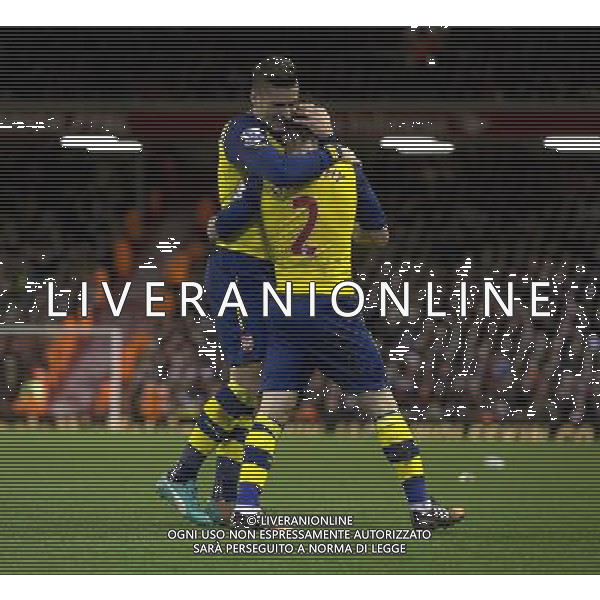 Arsenal\'s Mathieu Debuchy celebrates scoring his sides equalising goal to make the score 1-1 with team-mate Olivier Giroud Photographer Stephen White/CameraSport Football - Barclays Premiership - Liverpool v Arsenal - Sunday 21st December 2014 - Anfield - Liverpool © CameraSport - 43 Linden Ave. Countesthorpe. Leicester. England. LE8 5PG - Tel: +44 (0) 116 277 4147 - admin@camerasport.com - www.camerasport.com /Agenzia Aldo Liverani Sas - ITALY ONLY - EDITORIAL USE ONLY