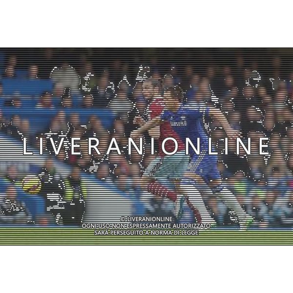Chelsea\'s John Terry under pressure from West Ham United\'s Andy Carroll Photographer Kieran Galvin/CameraSport Football - Barclays Premiership - Chelsea v West Ham United - Friday 26th December 2014 - Stamford Bridge - London © CameraSport - 43 Linden Ave. Countesthorpe. Leicester. England. LE8 5PG - Tel: +44 (0) 116 277 4147 - admin@camerasport.com - www.camerasport.com AG ALDO LIVERANI SAS ONLY ITALY