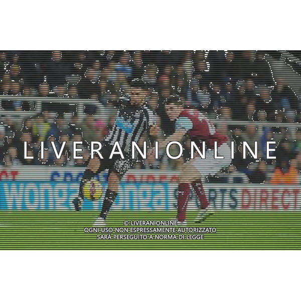 Newcastle United\'s Emmanuel Riviere shields the ball from BurnleyÕs Michael Keane Photographer Chris Vaughan/CameraSport Football - Barclays Premiership - Newcastle United v Burnley - Thursday 1st January 2015 - St James\' Park - Newcastle © CameraSport - 43 Linden Ave. Countesthorpe. Leicester. England. LE8 5PG - Tel: +44 (0) 116 277 4147 - admin@camerasport.com - www.camerasport.com /AGENZIA ALDO LIVERANI SAS - ITALY ONLY - EDITORIAL USE ONLY