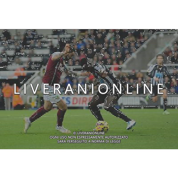 Burnley\'s Danny Ings vies for possession with Newcastle United\'s Cheik Ismael Tiote. The Burnley striker went down in the penalty area, but was booked for diving by Referee Mike Dean Photographer Chris Vaughan/CameraSport Football - Barclays Premiership - Newcastle United v Burnley - Thursday 1st January 2015 - St James\' Park - Newcastle © CameraSport - 43 Linden Ave. Countesthorpe. Leicester. England. LE8 5PG - Tel: +44 (0) 116 277 4147 - admin@camerasport.com - www.camerasport.com /AGENZIA ALDO LIVERANI SAS - ITALY ONLY - EDITORIAL USE ONLY