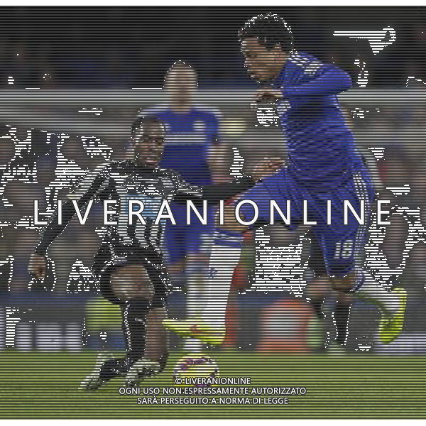 Chelsea\'s Loic Remy is tackled by Newcastle United\'s Vurnon Anita Photographer Craig Mercer/CameraSport Football - Barclays Premiership - Chelsea v Newcastle United - Saturday 10th January 2015 - Stamford Bridge - London © CameraSport - 43 Linden Ave. Countesthorpe. Leicester. England. LE8 5PG - Tel: +44 (0) 116 277 4147 - admin@camerasport.com - www.camerasport.com AG ALDO LIVERANI SAS ONLY ITALY