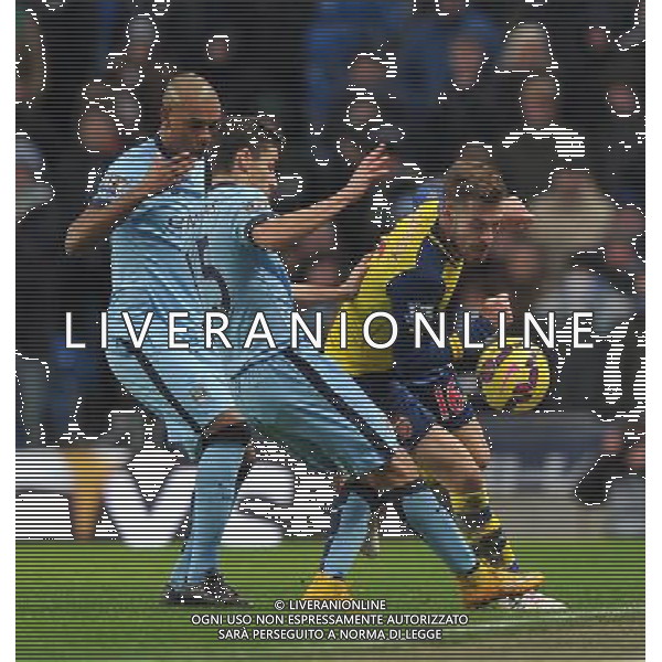 Arsenal\'s Aaron Ramsey battles with Manchester City\'s Jesœs Navas and Fernando Photographer Dave Howarth/CameraSport Football - Barclays Premiership - Manchester City v Arsenal - Sunday 18th January 2015 - Etihad stadium - Manchester © CameraSport - 43 Linden Ave. Countesthorpe. Leicester. England. LE8 5PG - Tel: +44 (0) 116 277 4147 - admin@camerasport.com - www.camerasport.com AG ALDO LIVERANI SAS ONLY ITALY