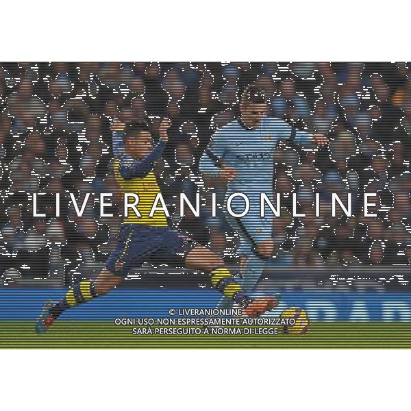 Manchester City\'s Stevan Joveti is tackled by Arsenal\'s Francis Coquelin Photographer Dave Howarth/CameraSport Football - Barclays Premiership - Manchester City v Arsenal - Sunday 18th January 2015 - Etihad stadium - Manchester © CameraSport - 43 Linden Ave. Countesthorpe. Leicester. England. LE8 5PG - Tel: +44 (0) 116 277 4147 - admin@camerasport.com - www.camerasport.com AG ALDO LIVERANI SAS ONLY ITALY