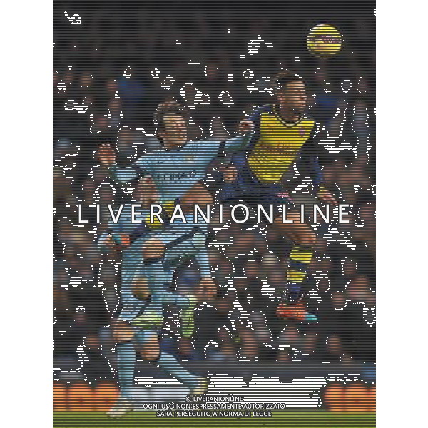 Manchester City\'s David Silva and Arsenal\'s Francis Coquelin jump for the ball Photographer Dave Howarth/CameraSport Football - Barclays Premiership - Manchester City v Arsenal - Sunday 18th January 2015 - Etihad stadium - Manchester © CameraSport - 43 Linden Ave. Countesthorpe. Leicester. England. LE8 5PG - Tel: +44 (0) 116 277 4147 - admin@camerasport.com - www.camerasport.com AG ALDO LIVERANI SAS ONLY ITALY