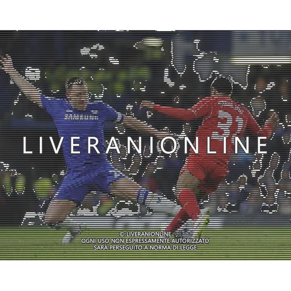 Liverpool\'s Raheem Sterling is tackled by Chelsea\'s John Terry Photographer Ashley Western /CameraSport Football - Capital One Cup Semi Final Second Leg - Chelsea v Liverpool - Tuesday 27th January 2015 - Stamford Bridge - London © CameraSport - 43 Linden Ave. Countesthorpe. Leicester. England. LE8 5PG - Tel: +44 (0) 116 277 4147 - admin@camerasport.com - www.camerasport.com /Agenzia Aldo Liverani sas - ITALY ONLY - EDITORIAL USE ONLY