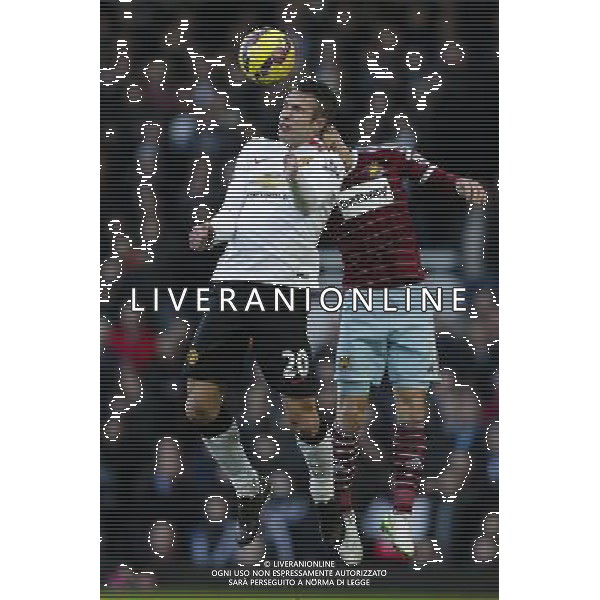 Manchester United\'s Robin van Persie wins a header from West Ham United\'s Aaron Cresswell Photographer Craig Mercer/CameraSport Football - Barclays Premiership - West Ham United v Manchester United - Sunday 8th February 2015 - Boleyn Ground - London © CameraSport - 43 Linden Ave. Countesthorpe. Leicester. England. LE8 5PG - Tel: +44 (0) 116 277 4147 - admin@camerasport.com - www.camerasport.com /Agenzia Aldo Liverani Sas - ITALY ONLY - EDITORIAL USE ONLY