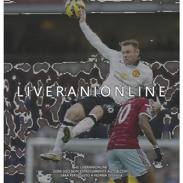 Manchester United\'s Wayne Rooney takes a tumble over the back of West Ham United\'s Alexandre Song Photographer Craig Mercer/CameraSport Football - Barclays Premiership - West Ham United v Manchester United - Sunday 8th February 2015 - Boleyn Ground - London © CameraSport - 43 Linden Ave. Countesthorpe. Leicester. England. LE8 5PG - Tel: +44 (0) 116 277 4147 - admin@camerasport.com - www.camerasport.com /Agenzia Aldo Liverani Sas - ITALY ONLY - EDITORIAL USE ONLY