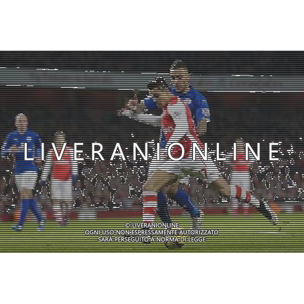 Arsenal\'s Alexis Sanchez gets a shot in despite the attentions of Leicester City\'s Danny Simpson Photographer Craig Mercer/CameraSport Football - Barclays Premiership - Arsenal v Leicester City - Tuesday 10th February 2015 - Emirates Stadium - London © CameraSport - 43 Linden Ave. Countesthorpe. Leicester. England. LE8 5PG - Tel: +44 (0) 116 277 4147 - admin@camerasport.com - www.camerasport.com AG ALDO LIVERANI SAS ONLY ITALY
