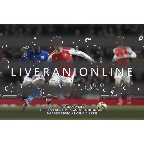Arsenal\'s Nacho Monreal battles for possession with Leicester City\'s Jeffrey Schlupp Photographer Craig Mercer/CameraSport Football - Barclays Premiership - Arsenal v Leicester City - Tuesday 10th February 2015 - Emirates Stadium - London © CameraSport - 43 Linden Ave. Countesthorpe. Leicester. England. LE8 5PG - Tel: +44 (0) 116 277 4147 - admin@camerasport.com - www.camerasport.com AG ALDO LIVERANI SAS ONLY ITALY