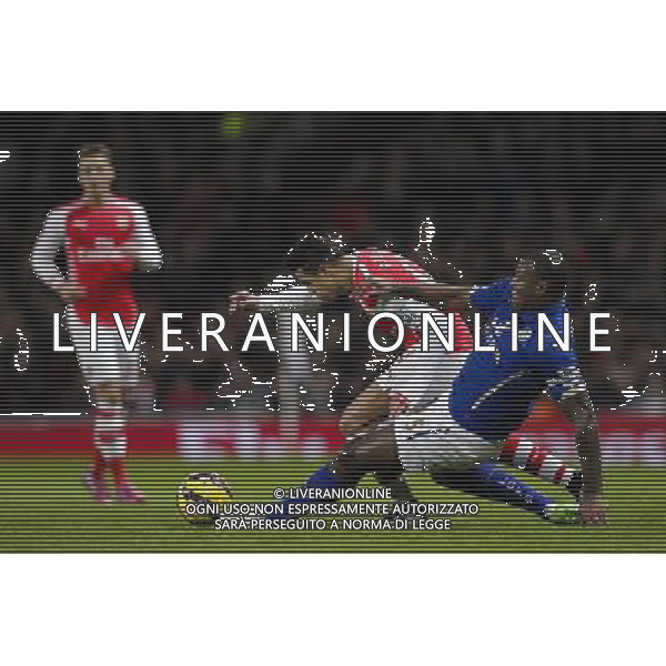 Arsenal\'s Alexis Sanchez is tackled by Leicester City\'s Wes Morgan Photographer Craig Mercer/CameraSport Football - Barclays Premiership - Arsenal v Leicester City - Tuesday 10th February 2015 - Emirates Stadium - London © CameraSport - 43 Linden Ave. Countesthorpe. Leicester. England. LE8 5PG - Tel: +44 (0) 116 277 4147 - admin@camerasport.com - www.camerasport.com AG ALDO LIVERANI SAS ONLY ITALY