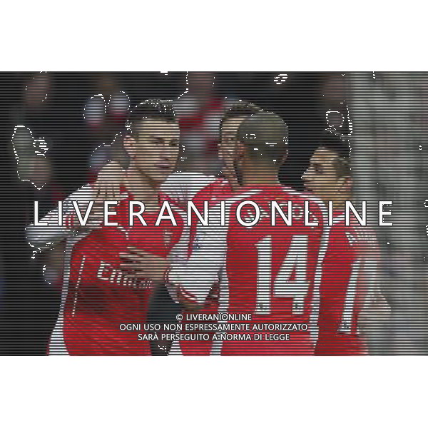Arsenal\'s Laurent Koscielny celebrates scoring his sides first goal with teammates Photographer Craig Mercer/CameraSport Football - Barclays Premiership - Arsenal v Leicester City - Tuesday 10th February 2015 - Emirates Stadium - London © CameraSport - 43 Linden Ave. Countesthorpe. Leicester. England. LE8 5PG - Tel: +44 (0) 116 277 4147 - admin@camerasport.com - www.camerasport.com AG ALDO LIVERANI SAS ONLY ITALY