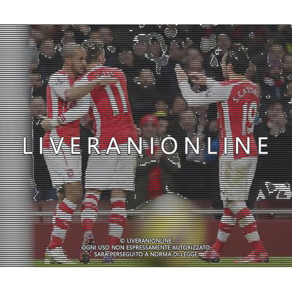 Arsenal\'s Theo Walcott celebrates scoring his sides second goal with teammates Photographer Craig Mercer/CameraSport Football - Barclays Premiership - Arsenal v Leicester City - Tuesday 10th February 2015 - Emirates Stadium - London © CameraSport - 43 Linden Ave. Countesthorpe. Leicester. England. LE8 5PG - Tel: +44 (0) 116 277 4147 - admin@camerasport.com - www.camerasport.com AG ALDO LIVERANI SAS ONLY ITALY