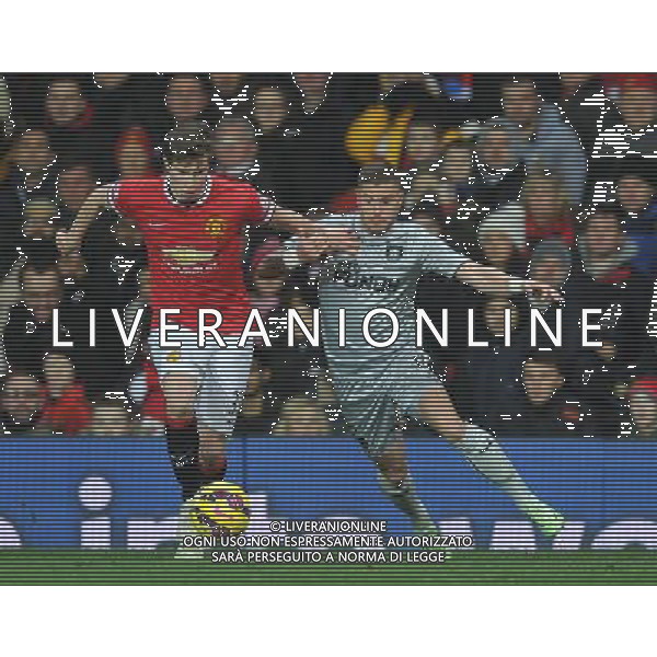 Manchester United\'s Paddy McNair battles with Burnley\'s Michael Kightly Photographer Dave Howarth/CameraSport Football - Barclays Premiership - Manchester United v Burnley - Wednesday 11th February 2015 - Old Trafford - Manchester © CameraSport - 43 Linden Ave. Countesthorpe. Leicester. England. LE8 5PG - Tel: +44 (0) 116 277 4147 - admin@camerasport.com - www.camerasport.com AG ALDO LIVERANI SAS ONLY ITALY