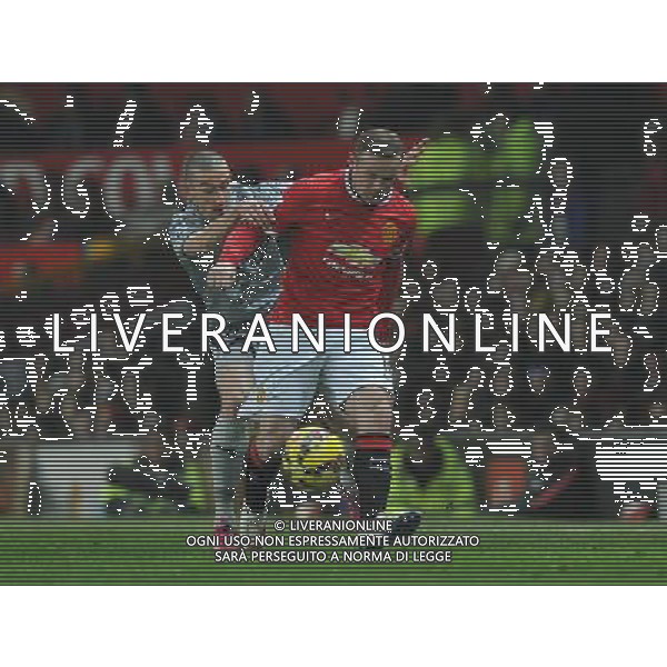 Burnley\'s David Jones battles with Manchester United\'s Wayne Rooney Photographer Dave Howarth/CameraSport Football - Barclays Premiership - Manchester United v Burnley - Wednesday 11th February 2015 - Old Trafford - Manchester © CameraSport - 43 Linden Ave. Countesthorpe. Leicester. England. LE8 5PG - Tel: +44 (0) 116 277 4147 - admin@camerasport.com - www.camerasport.com AG ALDO LIVERANI SAS ONLY ITALY