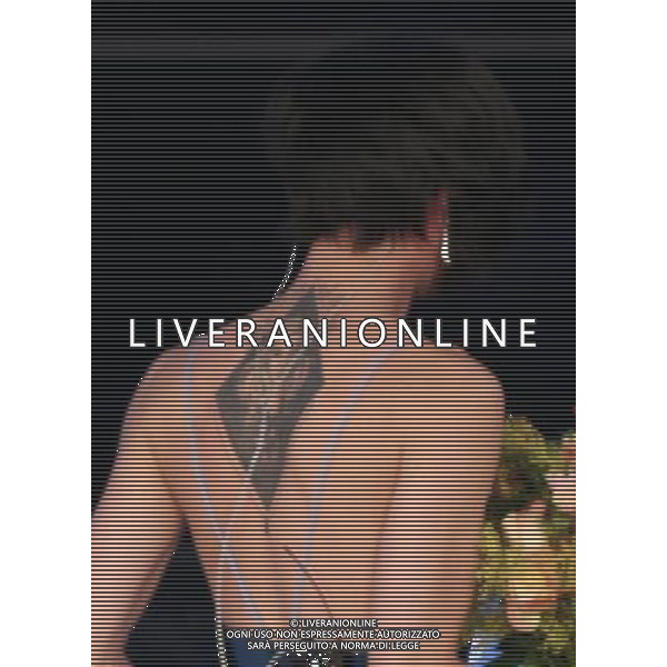 SECONDA SERATA 65mo FESTIVAL DELLA CANZONE ITALIANA DI SANREMO 11 FEBBRAIO 2015 nella foto Conchita Wurst con il tatuaggio con il viso della madre Â©Gazzaniga/Agenzia Aldo Liverani sas