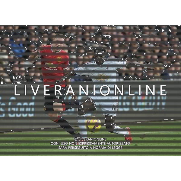 Manchester United\'s Phil Jones vies for possession with Swansea City\'s Bafetibis Gomis Photographer Ashley Crowden/CameraSport Football - Barclays Premiership - Swansea City v Manchester United - Saturday 21st February 2015 - Liberty Stadium - Swansea © CameraSport - 43 Linden Ave. Countesthorpe. Leicester. England. LE8 5PG - Tel: +44 (0) 116 277 4147 - admin@camerasport.com - www.camerasport.com AG ALDO LIVERANI SAS ONLY ITALY