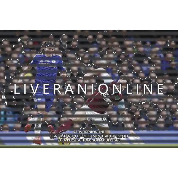 Chelsea\'s Filipe Luis is tackled by Burnley\'s Ashley Barnes Photographer Craig Mercer/CameraSport Football - Barclays Premiership - Chelsea v Burnley - Saturday 21st February 2015 - Stamford Bridge - London © CameraSport - 43 Linden Ave. Countesthorpe. Leicester. England. LE8 5PG - Tel: +44 (0) 116 277 4147 - admin@camerasport.com - www.camerasport.com AG ALDO LIVERANI SAS ONLY ITALY