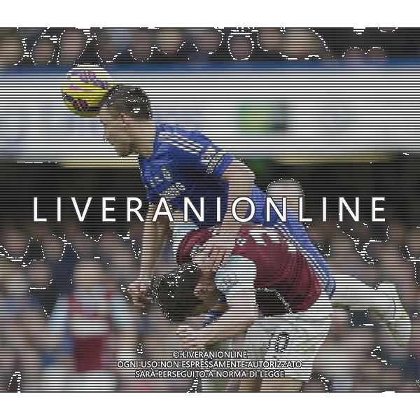 Chelsea\'s John Terry climbs over the back of Burnley\'s Ashley Barnes to win a header Photographer Craig Mercer/CameraSport Football - Barclays Premiership - Chelsea v Burnley - Saturday 21st February 2015 - Stamford Bridge - London © CameraSport - 43 Linden Ave. Countesthorpe. Leicester. England. LE8 5PG - Tel: +44 (0) 116 277 4147 - admin@camerasport.com - www.camerasport.com AG ALDO LIVERANI SAS ONLY ITALY