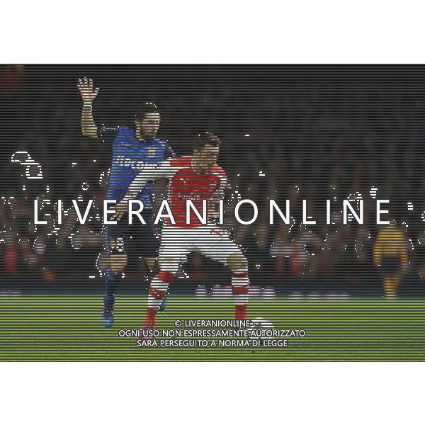 Arsenal\'s Mesut Ozil holds off the challenge from Monaco\'s Joao Moutinho Photographer Ashley Western/CameraSport Football - UEFA Champions League Second Round 1st Leg - Arsenal v Monaco - Wednesday 25th February 2015 - Emirates Stadium - London © CameraSport - 43 Linden Ave. Countesthorpe. Leicester. England. LE8 5PG - Tel: +44 (0) 116 277 4147 - admin@camerasport.com - www.camerasport.com AG ALDO LIVERANI SAS ONLY ITALY