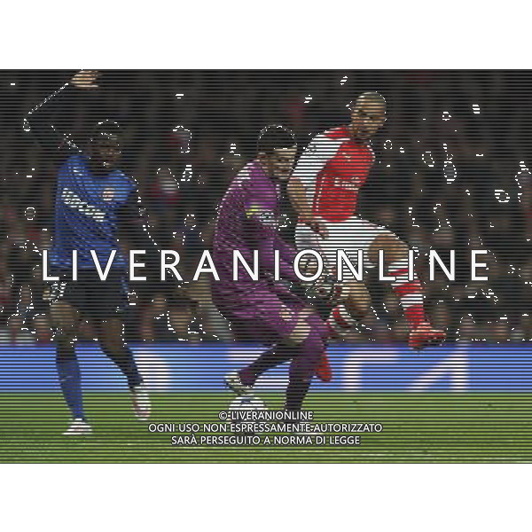 Arsenal\'s Theo Walcott is tackled by Monaco\'s Danijel Subasic Photographer Ashley Western/CameraSport Football - UEFA Champions League Second Round 1st Leg - Arsenal v Monaco - Wednesday 25th February 2015 - Emirates Stadium - London © CameraSport - 43 Linden Ave. Countesthorpe. Leicester. England. LE8 5PG - Tel: +44 (0) 116 277 4147 - admin@camerasport.com - www.camerasport.com AG ALDO LIVERANI SAS ONLY ITALY