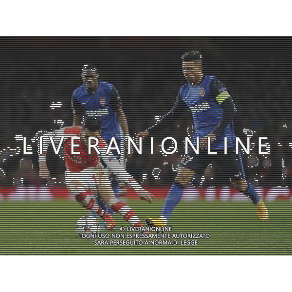 Arsenal\'s Alexis Sanchez holds off the challenge from Monaco\'s Nabil Dirar Photographer Ashley Western/CameraSport Football - UEFA Champions League Second Round 1st Leg - Arsenal v Monaco - Wednesday 25th February 2015 - Emirates Stadium - London © CameraSport - 43 Linden Ave. Countesthorpe. Leicester. England. LE8 5PG - Tel: +44 (0) 116 277 4147 - admin@camerasport.com - www.camerasport.com AG ALDO LIVERANI SAS ONLY ITALY