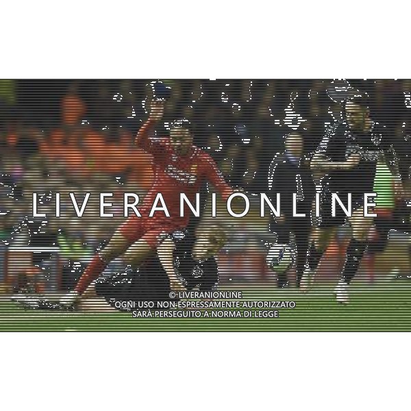 Liverpool\'s Raheem Sterling is tackled by Burnley\'s Ben Mee Photographer Dave Howarth/CameraSport Football - Barclays Premiership - Liverpool v Burnley - Wednesday 4th March 2015 - Anfield - Liverpool © CameraSport - 43 Linden Ave. Countesthorpe. Leicester. England. LE8 5PG - Tel: +44 (0) 116 277 4147 - admin@camerasport.com - www.camerasport.com /Agenzia Aldo Liverani sas - ITALY ONLY - EDITORIAL USE ONLY